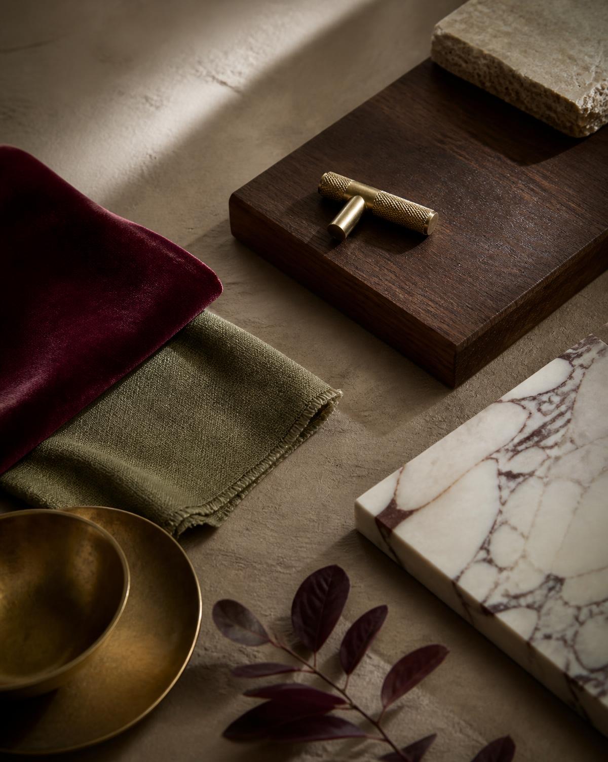 Burgundy velvet, olive linen, brass and marble samples chosen by LMC Interiors